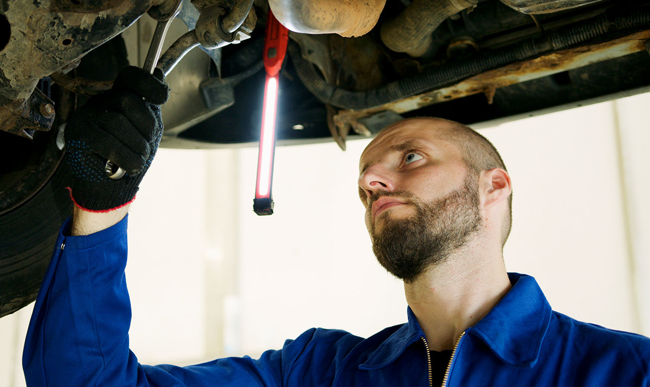 Mechanic Working on Car 1
